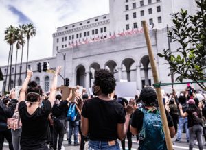 Black Lives Matter protestors throw hands up at City Hall